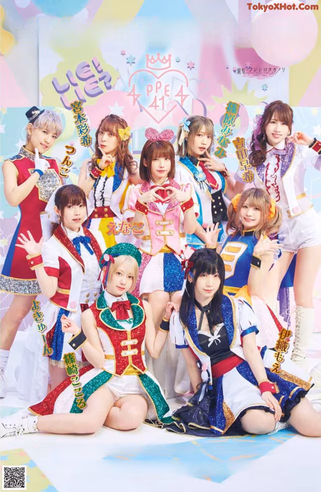 A group of girls in cheerleading uniforms posing for a picture.