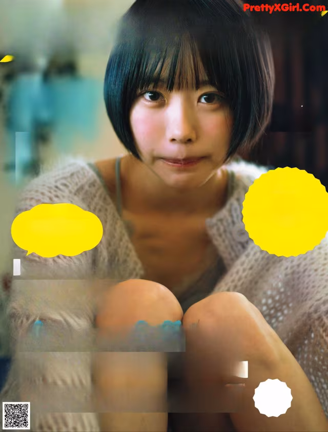 A magazine with a picture of a woman sitting on the cover.