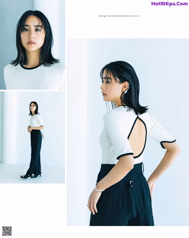 A woman in a white shirt and black pants.